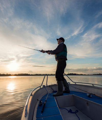 fishing on the lake at sunset