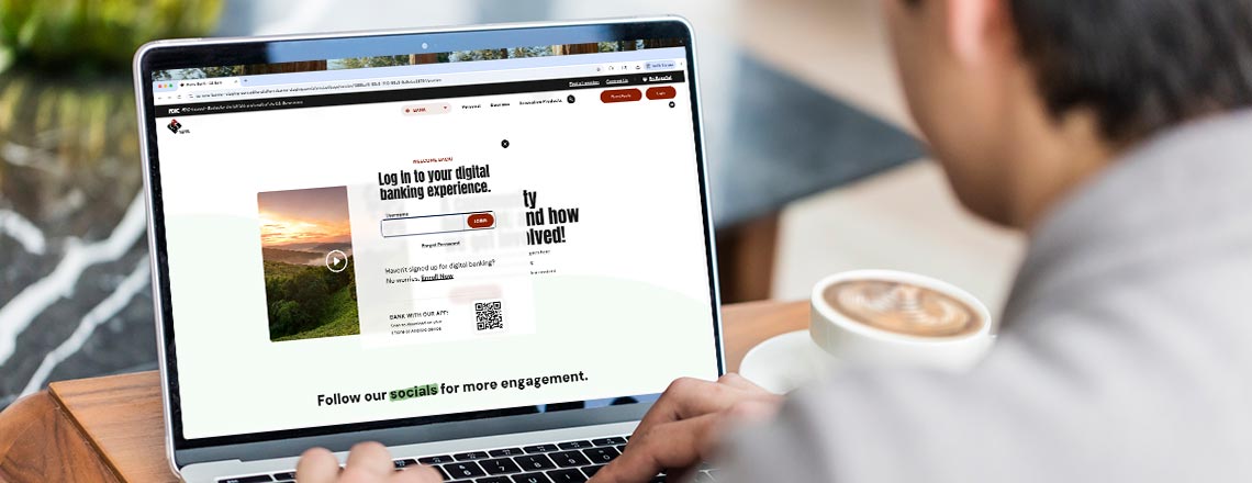 Man using laptop looking at the online banking login screen.