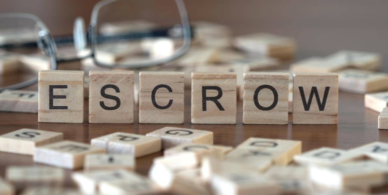 blocks that spell out ESCROW
