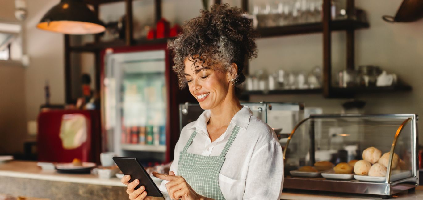 business owner looking at tablet